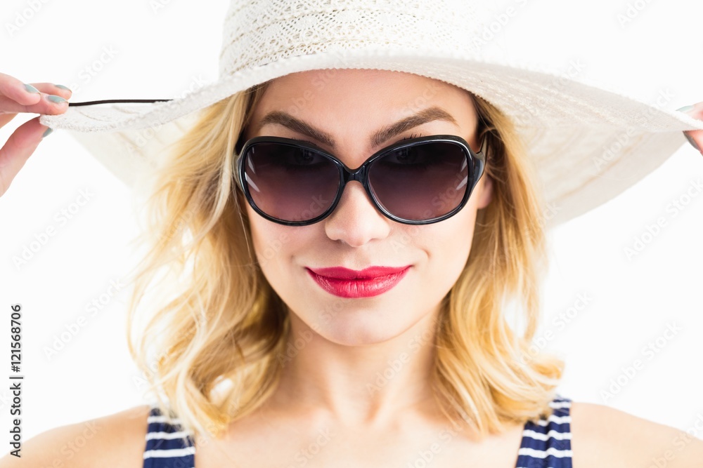 Beautiful woman posing with hat against white background Beautiful woman posing with hat against white background