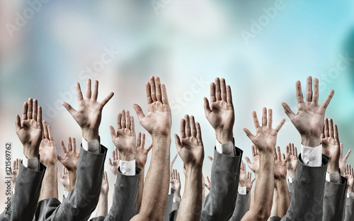 Group of people with raised hands