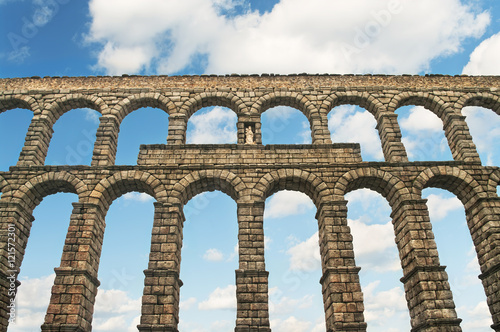 ancient aqueduct against blue sky