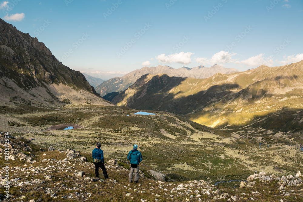 Tourists on a background of mountain scenery
