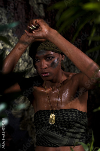 Strong black woman in jungle environment