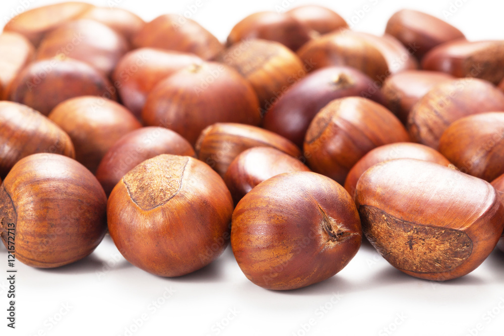 Group of grilled chestnuts. Isolate on white background. Autumn background. Group of grilled chestnuts. Isolate on white background. Autumn background.