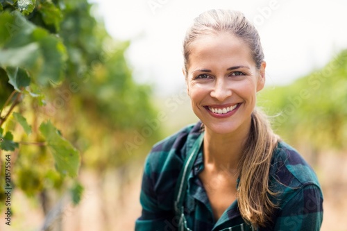 Portrait of happy female vintner