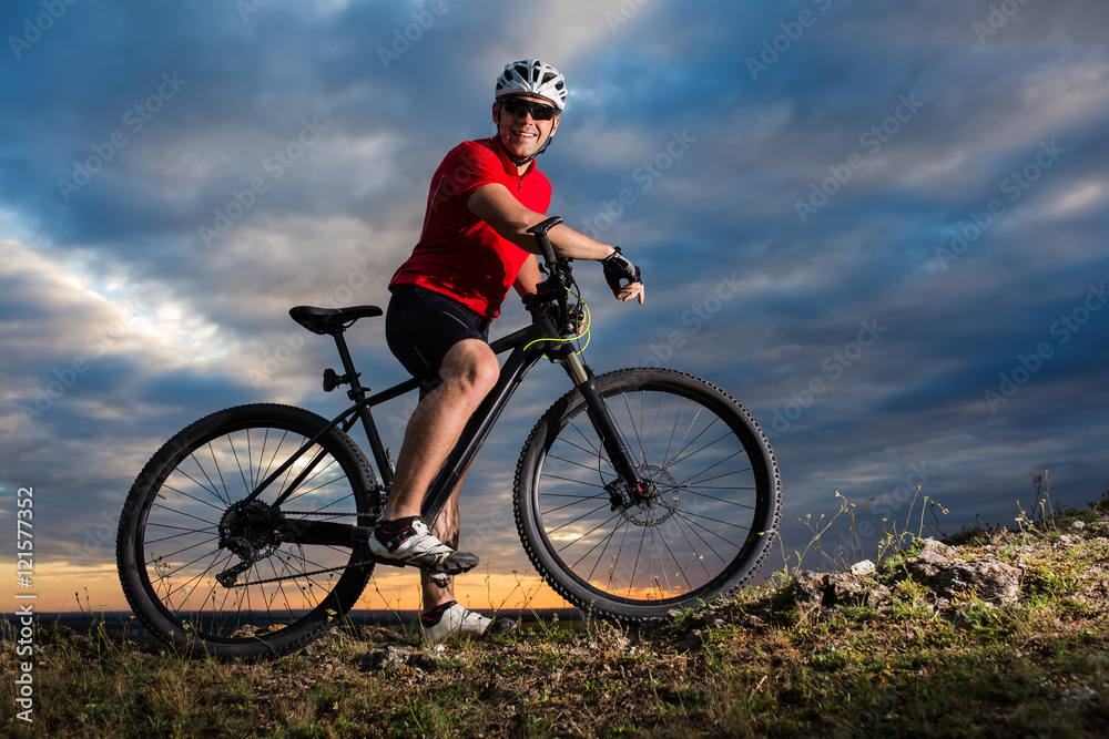 Man in helmet and glasses stay on the bicycle Man in helmet and glasses stay on the bicycle