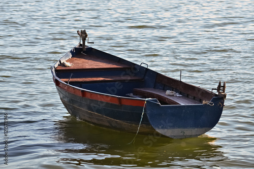 Photo Anchored old rowboat