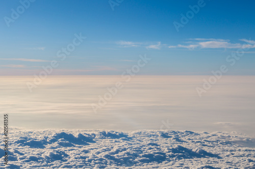 Blue sky with clouds aerial view froem the plane