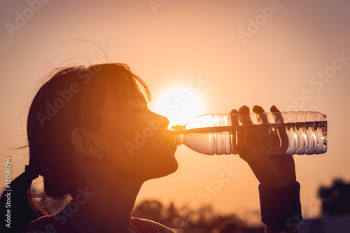 Female drinking a bottle of water