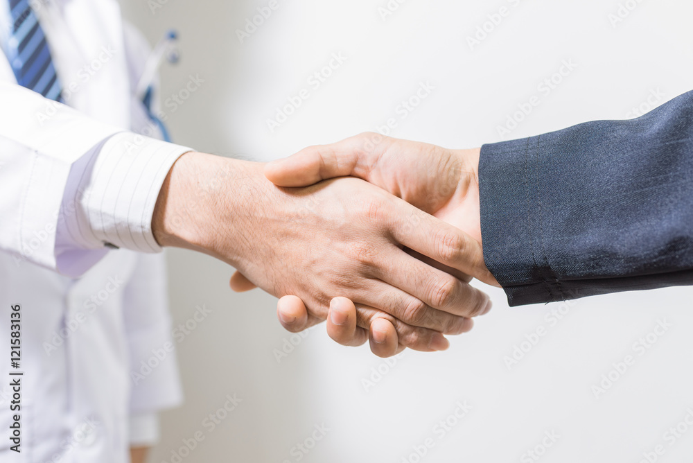 doctor and her lawyer shaking hands doctor and her lawyer shaking hands