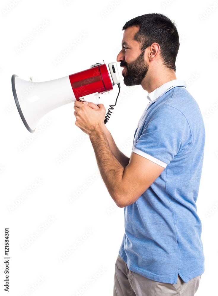 Man with blue shirt shouting by megaphone Man with blue shirt shouting by megaphone