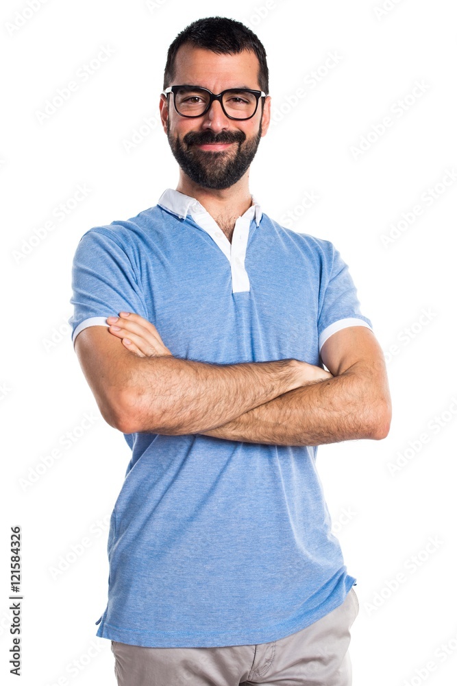 Man with blue shirt with his arms crossed Man with blue shirt with his arms crossed