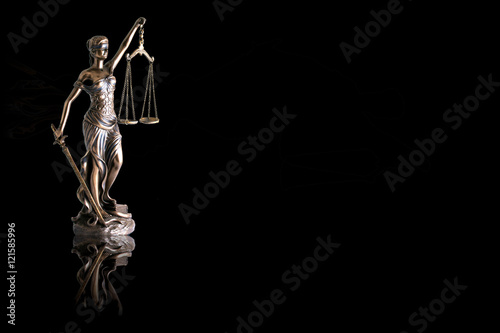 Lady justice or Themis with reflection  isolated on black background