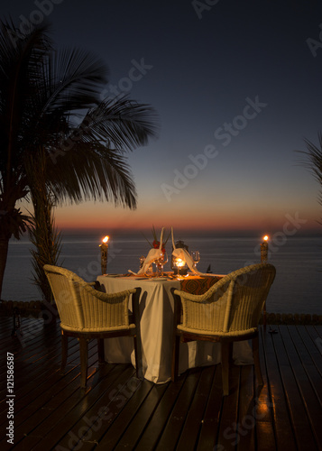 Romantic dinner on a idyllic island facing the Ocean. 