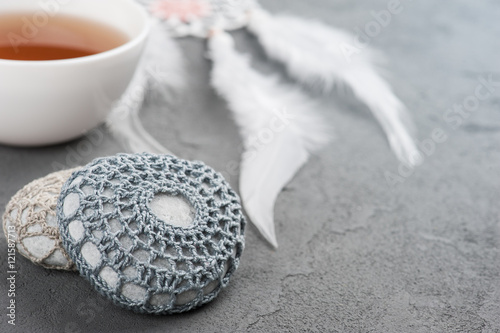 Fototapeta Naklejka Na Ścianę i Meble -  Cup of tea and crocheted pebbles