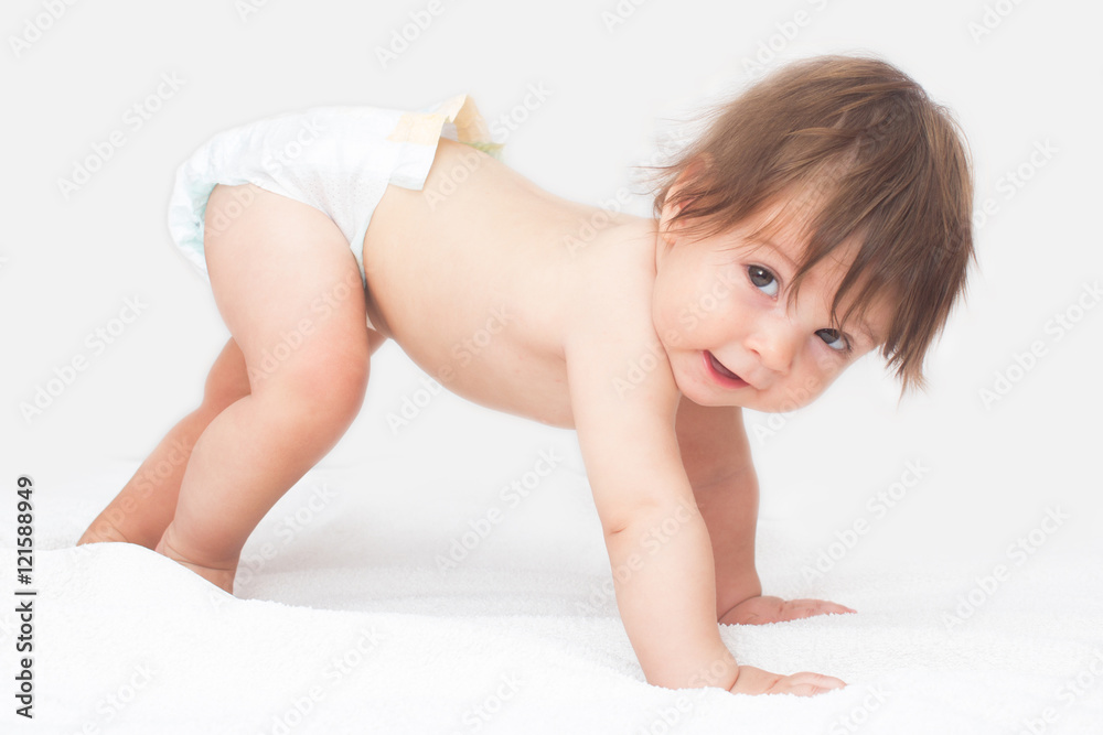 Bright picture of crawling baby girl in diaper. Bright picture of crawling baby girl in diaper.