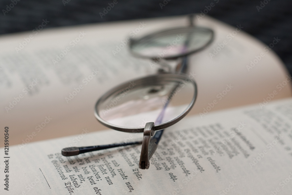 Round Eyeglasses on an antique book Round Eyeglasses on an antique book