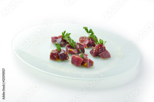 Chunks of rawbluefin tuna in ravigote sauce and parsley
