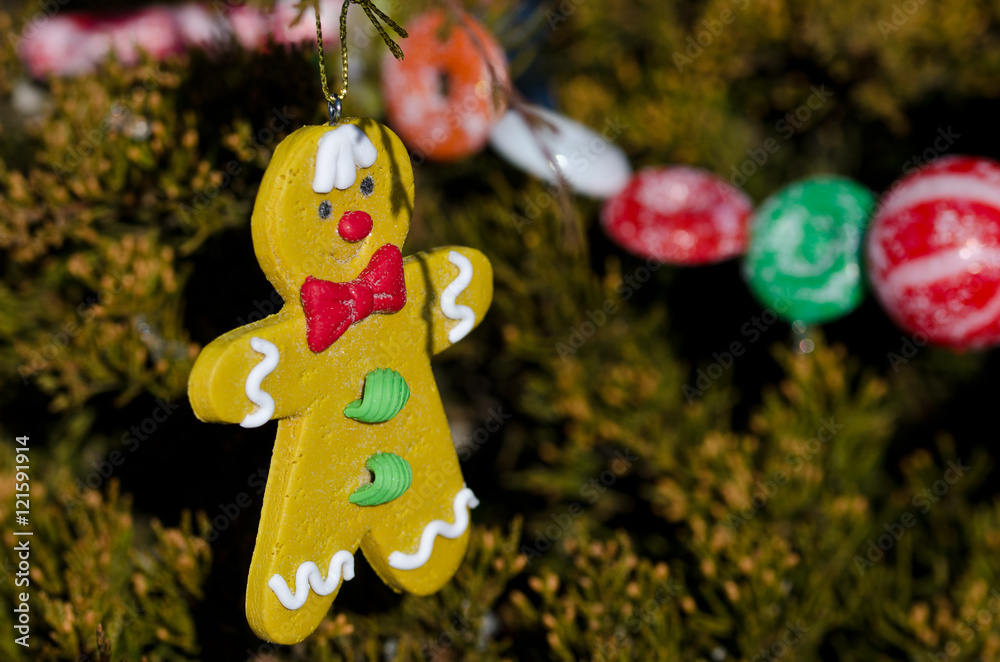 Gingerbread Man Decoration on an Outdoor Christmas Tree