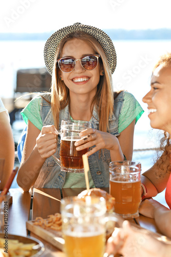 Young woman with glass of b...
