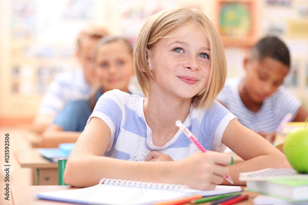 Cute schoolgirl in classroom on lesson Cute schoolgirl in classroom on lesson
