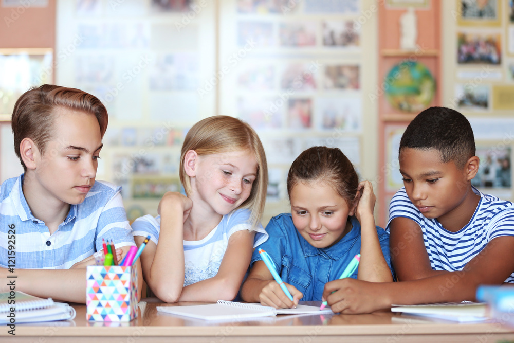 Cute schoolchildren in classroom on lesson Cute schoolchildren in classroom on lesson