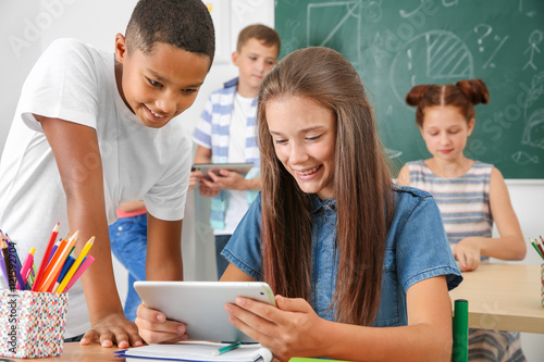 Pupils with tablet computer...