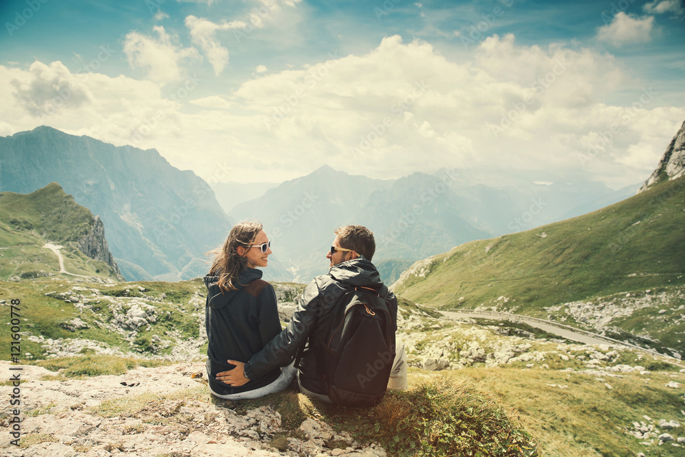 Couple of travelers on top of a mountain. Mangart, Julian Alps, National Park, Slovenia