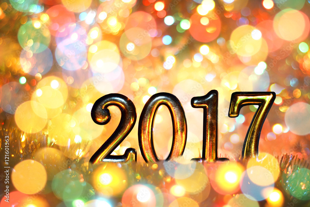 New year, Christmas background of colored holiday lights. Gold numbers 2017. New year, Christmas background of colored holiday lights. Gold numbers 2017.