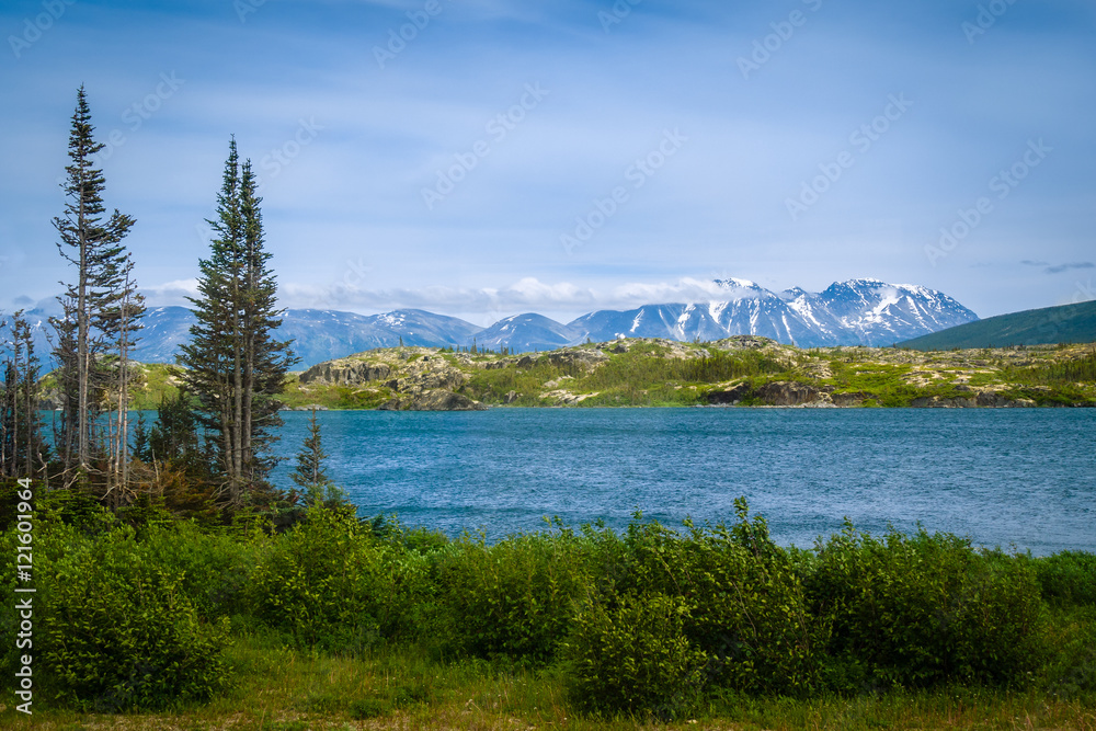 Lake in Frazer,  Canada with Snowcapped Mountains in Background 