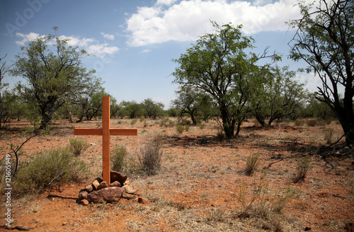 Cross in the Sonoran Desert between the US and Mexico, remembering a migrant who died on the same spot photo