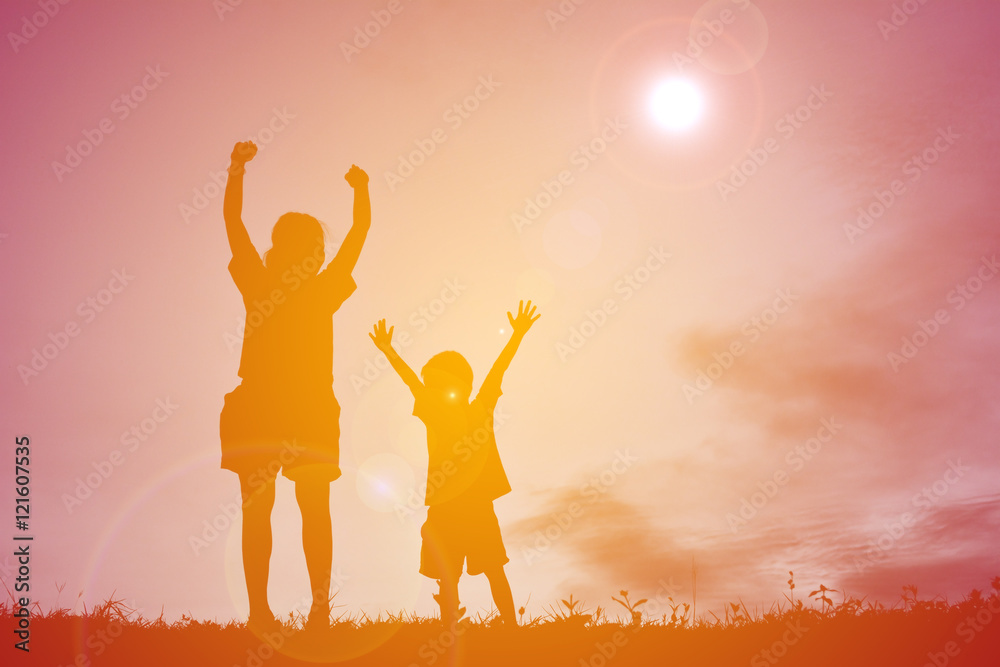 silhouettes mother and little son playing at sunset silhouettes mother and little son playing at sunset