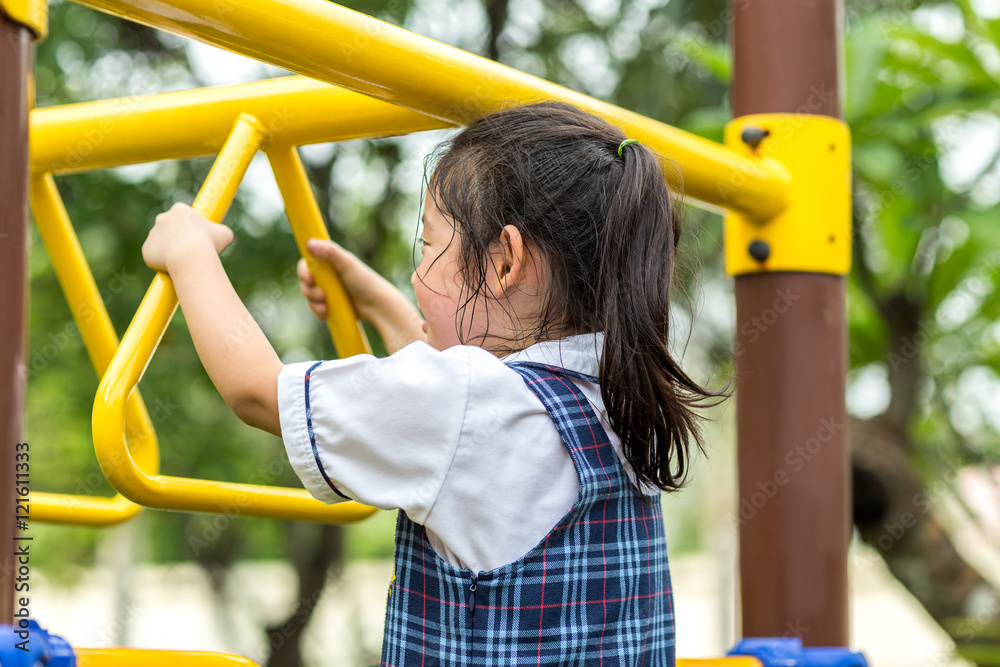 Fototapeta premium Child Hanging Bar at Playground