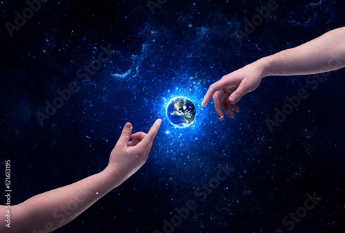 Hands in space touching planet earth