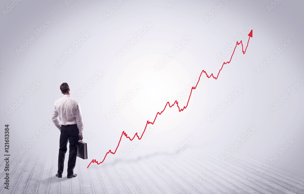 Standing businessman with red graph arrow Standing businessman with red graph arrow