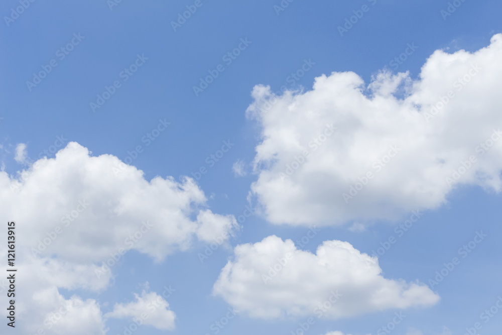Blue sky is covered by white clouds and raincloud 