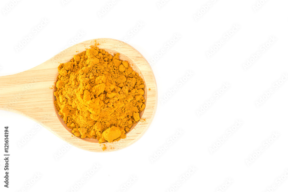 Turmeric powder in wood spoon on white background Turmeric powder in wood spoon on white background
