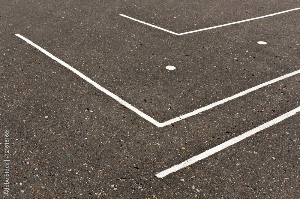 White lines on asphalt surface.