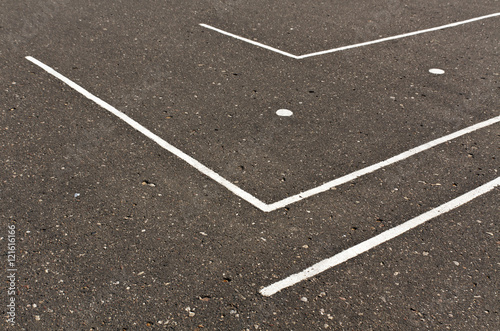 White lines on asphalt surface.