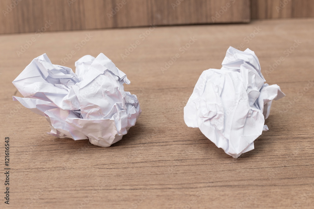 White paper sheet, paper Crumpled paper ball, on a wooden floor