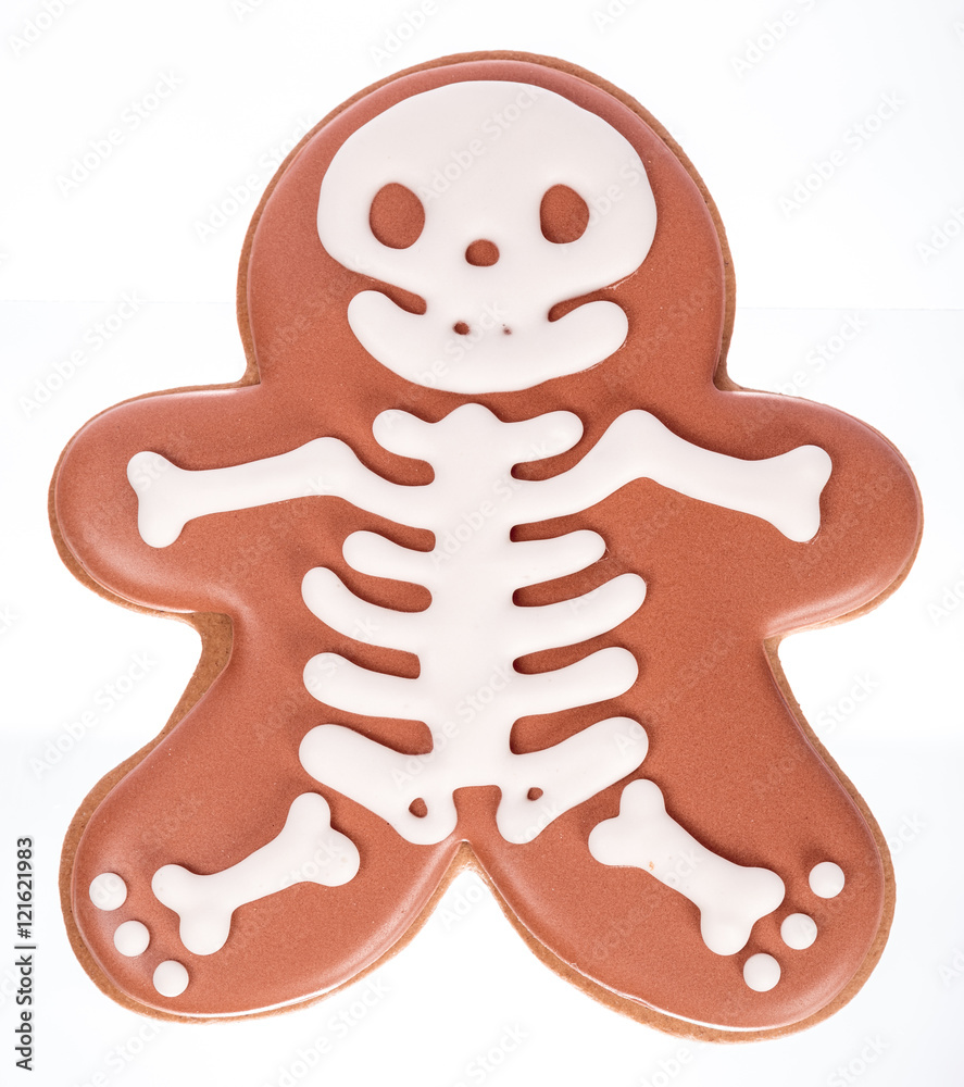 Obraz premium Funny beautiful delicious ginger biscuits Halloween in the form of a skeleton, isolated on white