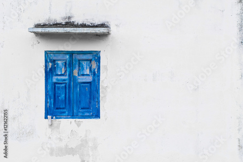 blue color windows on white wall with space for text.