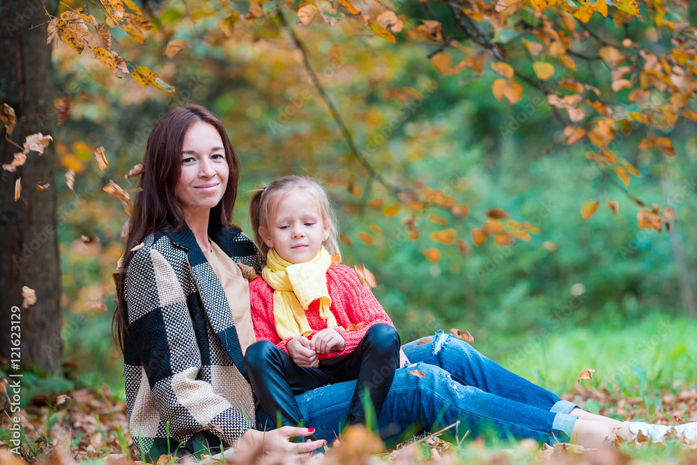 Happy mom with little girl on beautiful autumn day Happy mom with little girl on beautiful autumn day