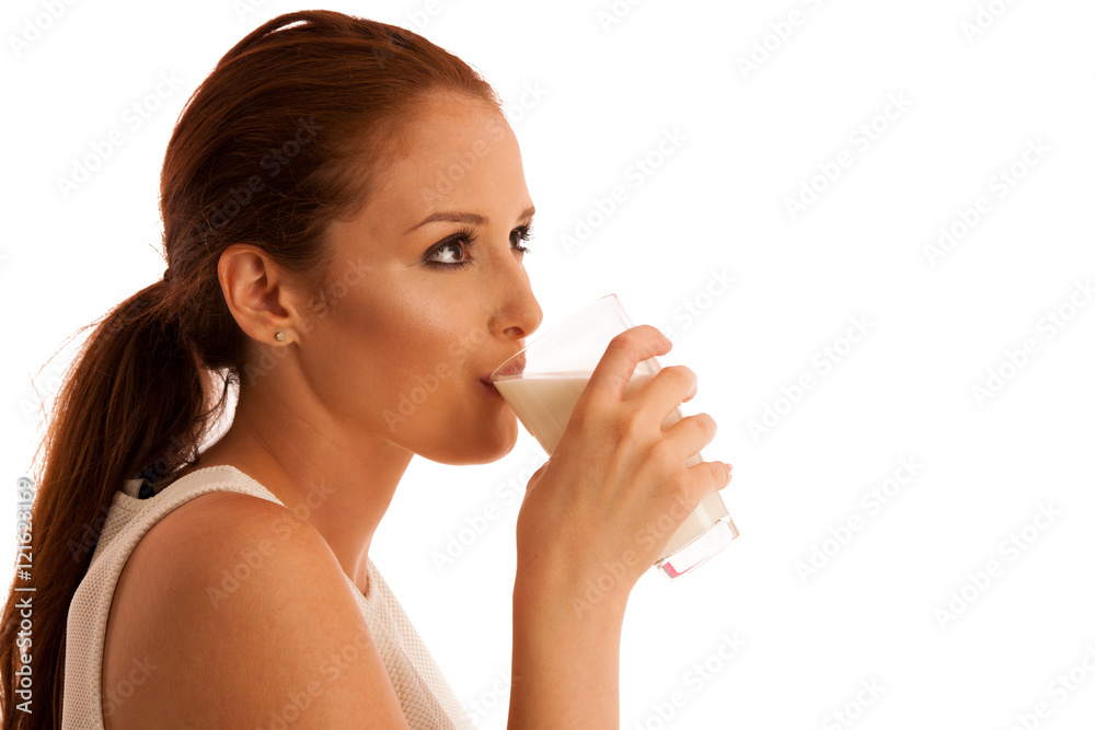 Woman drinking milk in the morning isolated over white backgroun Woman drinking milk in the morning isolated over white backgroun