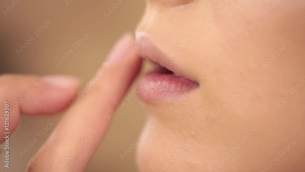 Process of lips make up with a paintbrush, backstage Process of lips make up with a paintbrush, backstage
