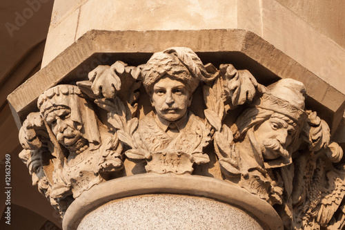 Capital of a column of the Cloth Hall (Sukiennice) decorated by polish artist Jan Matejko. Krakow, Poland. photo