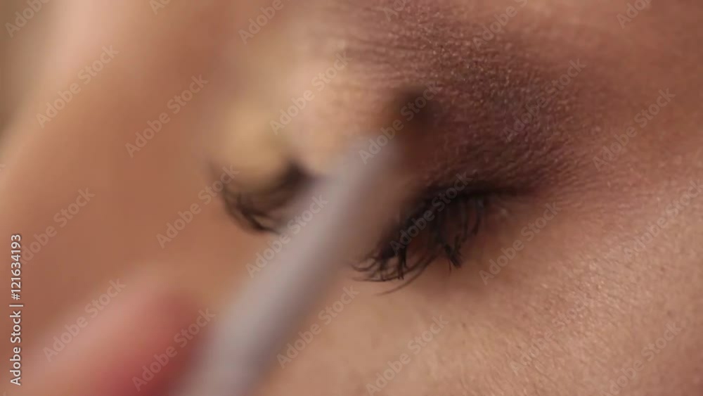 Process of applying eyeshadow, eye make up, backstage
