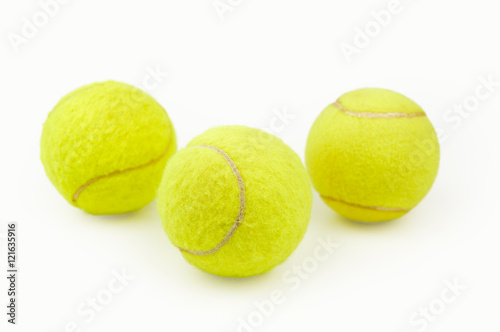 three tennis balls