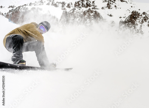 Snowboarder moving down