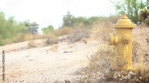 Yellow fire hydrant in Arizona desert close to a dead end road