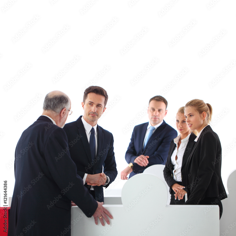 Fototapeta premium Business people assembling puzzle