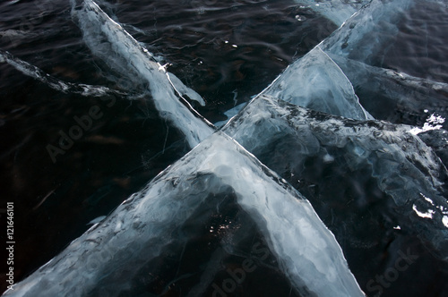 Winter. Ice on the surface of Lake Baikal. Ice thickness of about one meter. Cracks in the ice surface. Ice storm. Used toning of the photo.